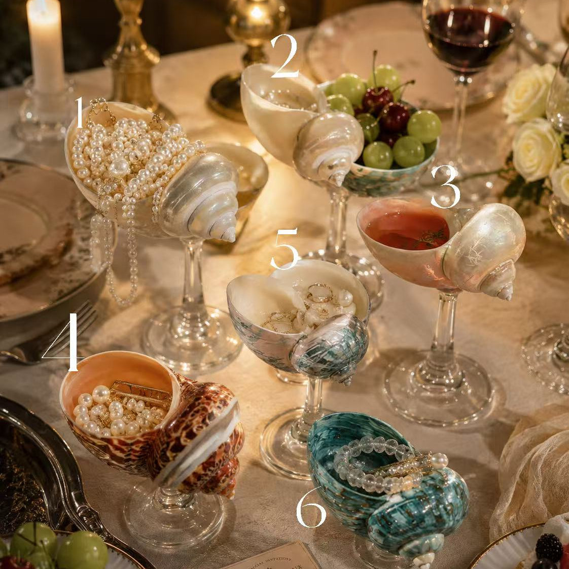 Six natural seashell goblet styles arranged on an elegant celebration table